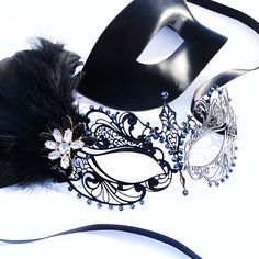 Couples masquerade masks, black feather, women metal mask and Venetian men mask Women black mask studded with black onyx rhinestones that give a hint of metallic shade. This mask has black with feathers with black/gold crystal brooch. Men's mask is a simple black base with a comfortable fit. S H I P P I N G - Processed same day or within 24 hours. 1-2 day guaranteed delivery services offered, add items to cart and click on shipping tab for rates. Please leave a check out note with your need date Adjustable Black Masquerade Mask For Carnival, Black Adjustable Masquerade Mask For Carnival, Black Masquerade Mask For Halloween Gift, Black Adjustable Masquerade Mask, Adjustable Black Masks And Prosthetics For Carnival, Black Masks For Halloween Gift, Black Halloween Masks As Gifts, Adjustable Black Eye Mask For Masquerade, Adjustable Black Masks And Prosthetics For Masquerade