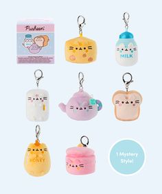 the keychain is shaped like different kinds of cats and kittens on them