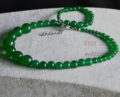 jewelry: green jade necklace colour: green Diameter: 4-12mm shape: round Necklace length: select Clasp: stainless steel lobster Clasp and chain Packing: Beautiful Pouch Click on the image(s) for larger view If you want to order of different style. Please feel free contact me . Thank you for your viewing. The other turquoise necklaces: https://www.etsy.com/shop/weddingpearl/search?search_query=turquoise+necklaces&order=date_desc&view_type=list&ref=shop_search Elegant Green Jewelry With 8mm Beads, Elegant Green 8mm Beads Jewelry, Elegant Green Round Beaded Necklaces, Elegant Green Round Beaded Necklace, Green Jade Necklaces For Weddings, Elegant Dark Green Round Bead Necklaces, Elegant Dark Green Round Beads Necklace, Elegant Dark Green Beaded Necklaces, Elegant Dark Green Round Beaded Necklaces