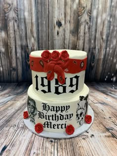 a three tiered birthday cake with red roses on the bottom and an old - fashioned design