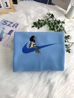 The Nike SZA With New Balances Embroidered Crewneck T-Shirt is a must-have for men and women. Its unique design features New Balances, Xmas Gifts For Her, Hawaiian Shirt Women, Embroidered Nike, Valentines Couple, Christmas Gifts For Couples, Cartoon Shirts, Embroidered Crewneck, Sweatshirt For Men