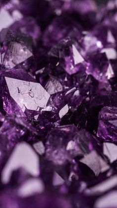 purple crystals are scattered on top of each other