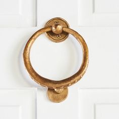 a close up of a door handle on a white door