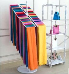 there is a rack with many different colored bags on it