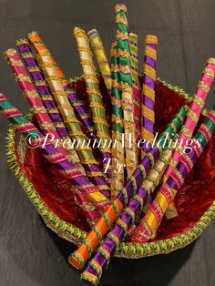 colorfully decorated straws in a basket on a table