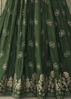 COLOR : Dark Mehendi Green FABRIC : Top - Pure Viscose Silk, Inner - Can Can, Dupatta - Chiffon/Net WORK : Zari, Woven Embroidery, Embroidered Waist Belt, Tassels, Embellished Lace BorderOCCASION : Wedding, Reception, Mehendi, Engagement, Party Wear, Festival READY-TO-WEAR : No STITCHING : Available as semi-stitched fabric, can be stitched using standard size option (+$20). Note: There might be a slight color variation due to lighting and flash used during photoshoot. The bright shade seen is th Green Resham Embroidery Choli Straight Kurta, Green Straight Kurta Choli With Resham Embroidery, Green Floor-length Art Silk Kurta, Semi-stitched Green Embroidered Fabric With Self Design, Green Lehenga With Intricate Embroidery And Straight Kurta, Green Art Silk Anarkali Set With Chikankari Embroidery, Green Lehenga With Chikankari Embroidery, Floor-length Green Set With Chikankari Embroidery, Green Chikankari Anarkali Set In Art Silk