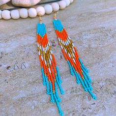 Gorgeous 7” Long Native Style Beaded Earrings In Teal / White / Orange Miami Dolphins Colors!! Step Up Your Game Day Look Or Just Rock These Earrings! Wear One Or Both Japanese Miyuki Glass Seed Beads - Known For High Quality And Uniform Shape 18k Gold Ear Wire Glass Beads Are Lightweight And Have Beautiful Glossy Shine Longer Gold Bugle Bead Accents Handmade In Delray Beach, Fl Etsy: Saltybeadssofl Contact Seller For Color Or Design Options! Multicolor Hand-strung Dangle Earrings, Orange Dangle Jewelry With Dangling Beads, Orange Jewelry With Dangling Beads, Blue Hand-strung Dangle Beaded Earrings, Orange Tiny Beads Drop Earrings, Orange Beaded Drop Earrings, Orange Dangle Jewelry With Colorful Beads, Orange Drop Earrings With Tiny Beads, Orange Drop Earrings With Dangling Beads