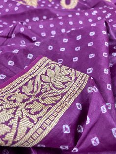 Handmade Semi Dupion Banarasi Silk Saree in Purple Color with Muted Gold Zari Weave Work. Please note - Color might look Light Purple in Sunlight and Dark Park in roomlight or dark light. Item : SareeBase Fabric : Semi Dupion Banarasi SilkColor : Purple Blouse piece : Comes with un-stitched Blouse piece.Blouse material : Dupion Banarasi SilkWork : HandwovenFall & Edging(Yes/No) : YesDisclaimer -:- Color variation is possible due to various reasons like phone or desktop setting, resolution etc. P Traditional Purple Slub Silk Sets, Slub Silk Kurta With Bandhani Print For Diwali, Festive Unstitched Bandhani Blouse Piece, Unstitched Dola Silk Blouse Piece With Bandhani Print, Unstitched Bandhani Blouse Piece For Festive Occasions, Slub Silk Blouse Piece With Bandhani Print For Puja, Unstitched Bandhani Print Blouse Piece For Puja, Festive Purple Slub Silk Traditional Wear, Bandhani Print Blouse Piece For Traditional Ceremonies