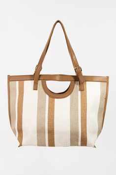 The Striped PU Leather Trim Tote Bag is a stylish and versatile accessory that combines classic stripes with a modern touch. This tote bag features a sleek PU leather trim that adds a sophisticated flair to the striped design. The contrasting textures create a chic and dynamic look, perfect for elevating your ensemble. With its spacious interior and durable construction, this tote bag is both fashionable and functional. Whether you're heading to work or running errands, this bag is a perfect blend of style and practicality. Make a statement with the Striped PU Leather Trim Tote Bag, a trendy and eye-catching accessory for any occasion. Bag size: Medium Imported Product measurements:One Size:Actual Length 18 in, Actual Height 20 in, Actual Width 5 in Stripes Design, Bottoms Pants, Running Errands, Set Dress, Leather Trims, Pu Leather, Stripes, Trim, Tote Bag