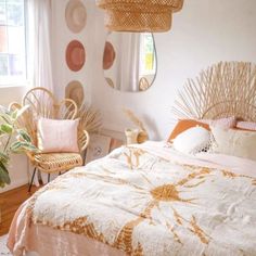 a bedroom decorated with wicker furniture and pink bedding in front of a window