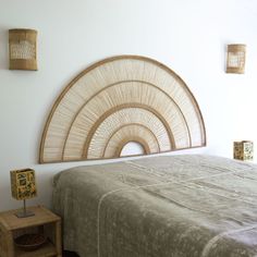 a bed with a wooden head board on the wall