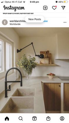 an instagram photo of a kitchen with white countertops and wooden cabinets, including a sink