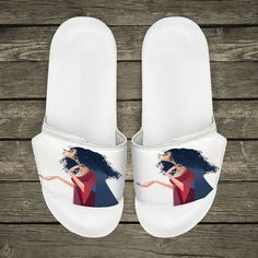 a pair of white slippers with an image of a woman on them