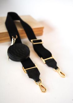 Cotton woven and leather belt, adjustable, with mini purse made of black embossed leather.The belt bag can be detached with a gold carabiner.All metal elements in gold.The strap fits all our bags. Dimensions:length 92-140 cm / 36,2”-55,1"width 4 cm / 1,5"bag diameter 9 cm /3,5”SHIPPINGFREEshipping wordwild - Express shipping UPS  3-4 Business days (please send us your hone number for the courier)Have a look at my other sections in my shop at the main menu:https://www.etsy.com/shop/kulikstyle?ref Elegant Bags With Adjustable Leather Strap, Adjustable Bag Strap With Key Leash For Everyday, Luxury Adjustable Bag Strap For Everyday Use, Adjustable Black Bag For Fashion Accessories, Luxury Bag Strap With Adjustable Strap For Everyday Use, Luxury Adjustable Strap Bag Strap For Everyday Use, Everyday Use Crossbody Bag Strap With Key Leash, Adjustable Leather Crossbody Strap, Everyday Crossbody Bag Strap With Key Leash