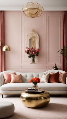 a living room with pink walls and gold accents