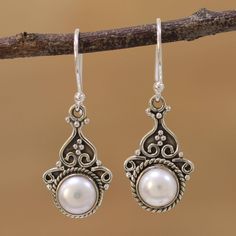 Cultured pearls shine in tandem in these dangle earrings from Alok Jain. Each gem is held within a rope design and crowned with dots and curls of sterling silver. An oxidized finish that gives the earrings a charming antique appearance. Elegant Silver Pearl Earrings With French Hook, Ornate White Pearl Drop Earrings, Silver Dangle Pearl Earrings With French Hook, Pearl Earrings With French Hook For Gift, Ornate Dangle Pearl Drop Earrings, Marcasite Jewelry, Pearl Accessories, Pearl Dangle Earrings, Silver Jewelry Design