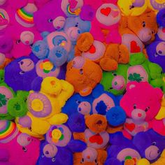 there are many different colored teddy bears together