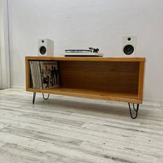 Showcase your turntable and vinyl record collection. Perfect for music lovers who need a record player stand and storage for records. The handcrafted design ensures that each unit is unique and made to the highest standards. Wood Thickness: 1.5 in Length (left to right): 45 in Depth: (front to back): 14 in Wooden External Height: 16 in Internal Height: 13 in Hairpin Leg Height: 6 in Unit with Legs Height: 22 in Size: 45".  Color: Brown. Record Organizer, Storage Entertainment Center, Entertainment Center Design, Record Shelf, Record Player Stand, Coffee Table Kitchen, Vinyl Record Collection, Bathtub Remodel, Marble Tile Floor