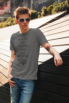 This inspirational t-shirt is perfect for any occasion and makes a great gift for friends and family. Whether you’re shopping for yourself or someone else, this shirt will remind them that they are the authors of their own stories. With its empowering message and stylish design, the “Everyday is a Page Be the Author” t-shirt is the perfect way to express your individuality and let the world know that you are in charge of writing your own story. This t-shirt is everything you've dreamed of and more. It feels soft and lightweight, with the right amount of stretch. It's comfortable and flattering for all. • 100% combed and ring-spun cotton (Heather colors contain polyester) • Fabric weight: 4.2 oz/yd² (142 g/m²) • Pre-shrunk fabric • Side-seamed construction • Shoulder-to-shoulder taping • Bl Bookish Short Sleeve T-shirt With Funny Text, Bookish T-shirt With Funny Text And Crew Neck, Literary Relaxed Fit Crew Neck T-shirt, Literary Cotton Relaxed Fit T-shirt, Literary Style Cotton T-shirt With Relaxed Fit, Short Sleeve T-shirt With Funny Text, Literary Crew Neck T-shirt With Screen Print, Screen Print Crew Neck T-shirt, Literary Cotton T-shirt With Text Print