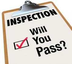 a clipboard that says inspection will you pass?