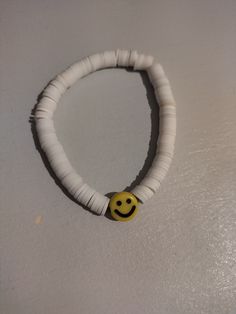 a bracelet with a smiley face on it