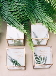 four small boxes with wedding cards in them