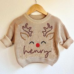 Custom Name Reindeer Baby Deer First Christmas Sweatshirt, Cute X-mas Baby Sweater, Fall Autumn Baby Shower Newborn Announcement Gifts Keep your little one cozy in our baby sweatshirt, made from soft, premium cotton blend fabric for maximum comfort. This lightweight yet warm sweatshirt is gentle on delicate skin, perfect for everyday wear. The ribbed cuffs and hem ensure a snug fit, while the easy-to-pull-over design makes dressing a breeze. Available in a variety of adorable colors and prints, Newborn Christmas Outfit Boy, Embroidery Sweater Diy, Baby Christmas Sweater, Newborn Christmas Outfit, Newborn Announcement, Boys Christmas Outfits, Kids Christmas Sweaters, Diy Baby Gifts, Embroidery Sweater