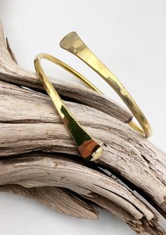 Add some shine to your look with our Gold Twist Bangles. Hammered golden bracelets are polished to a gleam and adjustable for the perfect fit. The perfect boho-style addition to any outfit and existing bracelets. Hammered brass Jewelry by Real To The Roots is made with materials from the earth like metal, genuine leather and crystals rather than man-made materials like plastics. Real and natural materials help us stay grounded and connected to the earth while crystals can have positive impact on Adjustable Hand Forged Bronze Bracelets, Adjustable Gold Bangle Jewelry, Adjustable Gold Bracelets With Polished Finish, Gold Resizable Bracelets For Festival, Resizable Gold Bracelets For Festivals, Gold Festival Bracelets, Elegant Adjustable Brass Cuff Bracelet, Adjustable Minimalist Brass Bracelets, Minimalist Adjustable Brass Bracelets