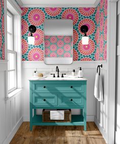 a bathroom with pink, blue and green wallpaper on the walls next to two sinks