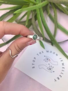 Emerald crystal set in a handcrafted sterling silver ring, on a 3mm hammered thick ring band. Size R 1/2. 925 sterling silver.  This piece is made to a specific size so please check this before ordering. Sizes cannot be changed. 🌙 All orders come packed in a re-usable gift pouch.  To see how your rings are made, take a look at my Instagram: @stopthemoon_ Sterling Silver Open Emerald Ring As Birthstone, Hammered Sterling Silver Jewelry For Promise, Silver Sterling Silver Emerald Ring For Promise, Sterling Silver Stackable Emerald Ring As Gift, Silver Emerald Stackable Ring With Round Band, Sterling Silver Open Ring Birthstone Ring, Everyday Sterling Silver Birthstone Ring With Open Ring Shape, Adjustable Sterling Silver Crystal Ring For May Birthstone, Stackable Sterling Silver Emerald Ring