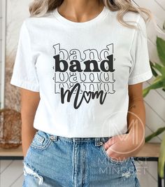 Band Mom Shirt, Marching Band Mom, Band Mom Life Tee, Drumline Mama, Gift for Band Mom, All About Halftime Shirt, Band Mama Shirt Bella Canvas 3001T:  T-Shirt Sizing Please reference the size chart before selecting shirt size.  Use one of your own t-shirts to measure the size and fit.  Then compare with the size chart provided to ensure an accurate fit. T-Shirt Materials 100% combed and ring-spun cotton. Heather colors are 90% combed and ring-spun cotton, 10% polyester. Pre-shrunk fabric. Should Mom Life Shirt Ideas, White Cotton Shirt With Band Logo, White Cotton Band Logo Top, White Cotton Top With Band Logo, Cotton Band Merch Tops With Lettering, White Cotton Shirt With Lettering, Band Mom Shirts Ideas, Marching Band Mom, Band Mom Shirts