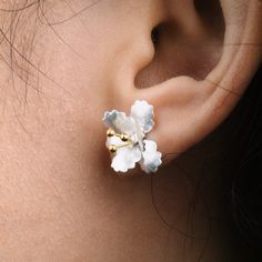 These delicate elegant floral stud earrings made by s925 sterling silver are inspired by our beautiful nature. This pair of fine earpieces is suitable for all casual and special occasions, such as weddings, parties, anniversaries, etc.  Materials:  Sterling Silver  Cyan Art Store creates dainty jewelry that is inspired by antique and tribal designs from around the globe.   All of our pieces are handmade so keep in mind that the final product might deviate slightly from the pictured product. Sterling Silver Birth Flower Earrings, Silver Single Flower Earring, Dainty Silver Birth Flower Earrings, Sterling Silver Flower Earring, Delicate Sterling Silver Birth Flower Earrings, Sterling Silver Flower Single Earring, Elegant Birth Flower Earrings, Delicate Silver Earrings With Birth Flower, Silver Delicate Birth Flower Earrings