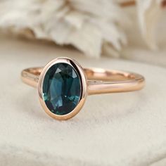 Simplicity in Beauty: Minimalist Oval Cut Bezel Lab Blue Green Sapphire Engagement Ring in 14k Rose Gold. Blue Green Sapphire Engagement Ring, Green Sapphire Engagement, Green Sapphire Engagement Ring, Blue Green Sapphires, Sapphire Engagement Ring, Green Sapphire, Affordable Jewelry, Sapphire Engagement, Engagement Rings Sapphire