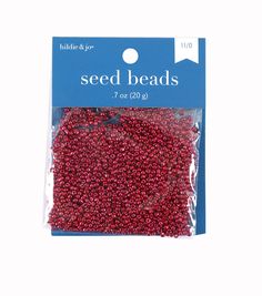 red seed beads are packaged in a plastic bag on a white background with the package