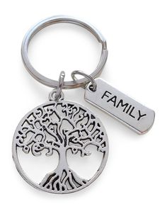 a family tree keychain with the word family engraved on it's side