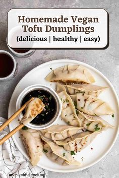 homemade vegan tofu dumplings on a plate with dipping sauce and chopsticks