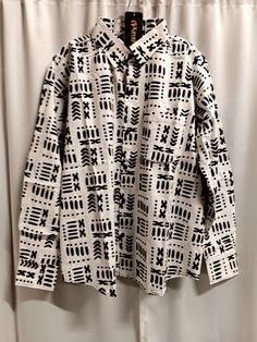 Beautiful African print white and black long sleeve men's shirt, button down front shirt. 100% Cotton  Lovely quality suitable for all occasions year round. sizes Medium through 3xl. Oversized Long Sleeve Shirt With Abstract Print, White Long Sleeve Tops With Abstract Print, White Long Sleeve Top With Abstract Print, White Long Sleeve Shirt With Button Closure, Patterned Button-up Shirt With Graphic Print, Patterned Graphic Print Button-up Shirt, White Printed Long Sleeve Shirt, Patterned Oversized Long Sleeve Shirt, Oversized Long Sleeve Patterned Shirt