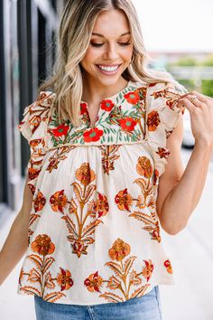 You are going to love this blouse! It's just that simple! This blouse has such a fun retro print and those colors are going to be fabulous for going into the fall season! This blouse is going to look so good with shorts now and jeans later! This blouse features a retro floral print, ruffled cap sleeves, a split v-neck, and an embroidered yoke.  Material has no amount of stretch.Cam is wearing the small. Floral Cocktail Dress, Black Tie Dress, Long Sleeve Outerwear, Two Piece Swimwear, Retro Print, Friend Outfits, Romper With Skirt, Retro Floral, Retro Prints