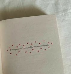 an open book with some red hearts on it and the words to everyone who's ever told this they aren't enough