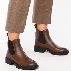 A Subtle Lug Sole Adds Utilitarian Charm To These Classic Leather Chelsea Boots. Leather Upper Round Toe Pull-On Style Elasticized Sides Heel Tab Man-Made Lining Rubber Sole Imported Block Heel, 0.75" (20mm) Shaft, 4.75" Leg Opening, 9.75" New Without Box With Store Markings At The Bottom. Faux Leather Chelsea Boots For Work, Brown Chelsea Boots With Removable Insole, Fall Chelsea Boots With Removable Insole, Flat Heel Chelsea Boots With Rubber Sole For Work, Chelsea Boots With Leather Footbed And Medium Width, Medium Width Chelsea Boots With Leather Footbed, Fall Chelsea Boots With Cushioned Footbed And Round Toe, Casual Coach Ankle Boots, Casual Brown Coach Boots