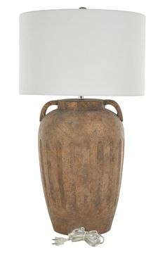 Illuminate your space with a touch of style. Perfect for any room, this accent table lamp will make a refreshing and stylish addition to your space. 16" x 16" x 29" lamp; 58" cord Ceramic/linen Imported Academia Interior, Dark Academia Interior, Vuarnet Sunglasses, Ceramic Table Lamp, Designer Crossbody Bags, Ceramic Table Lamps, Ranch Style, Sweaters And Leggings, Ceramic Table