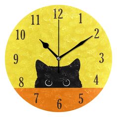 a yellow clock with a black cat on it