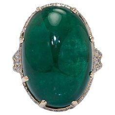 25.25cts Cabochon Oval Emerald Ring Deep green emerald cabochon 25.25cts in a three row split ring with diamond pavé and a diamond halo. A beautiful centerpiece made by hand at Kaufmann de Suisse's atelier. 25.25cts AAA oval cabochon emerald 148 brilliant cut diamonds 1.23ctw 18k yellow gold Oval Emerald Ring, Emerald Cabochon, Pear Shaped Diamond Ring, Smaragd Ring, Diamond Glitter, Ring With Diamond, Diamond Cocktail Rings, Sapphire Bracelet, Modern Ring