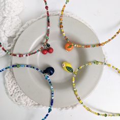 Cute beaded necklaces with tiny dangly summer fruit charms! - 4 variations: blueberry, orange, cherry, lemon - Total beaded length: 30 cm (15 cm half length) - Extra chain length: 7 cm Summer Multicolor Beaded Necklaces With Dangling Beads, Summer Necklaces With Dangling Round Beads, Summer Necklace With Dangling Beads, Summer Gift Necklaces With Dangling Beads, Summer Gift Necklace With Dangling Beads, Beaded Blueberries, Summer Orange Beaded Necklaces, Orange Beaded Necklace For Summer, Summer Beaded Dangle Necklaces