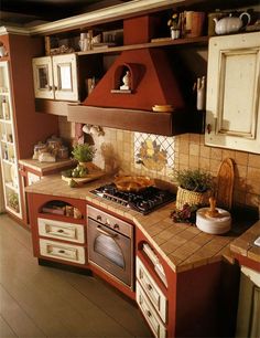 a kitchen with an oven, stove and counter top in it's center island