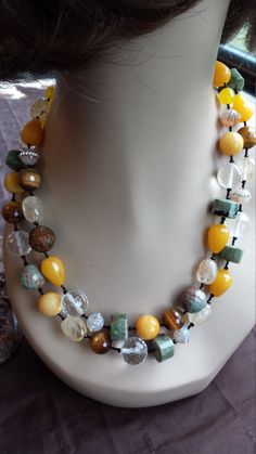 "Two strand beaded faceted necklace made with faceted chrysophrase, jade, citrine, tiger eye, clear faceted crystal, inlaid crystal jasper. This stunning necklace measures 20\" long and beads measure about 12mm. Looks great with lots of outfits. If you like it \" pin it \" or share on Facebook." Unique Faceted Round Bead Necklaces, Unique Faceted Round Bead Necklace, Yellow Gemstone Beads For Jewelry Making, Yellow Necklaces With Natural Stones In Round Beads, Yellow Necklaces With Natural Stones And Round Beads, Yellow Necklaces With Natural Round Beads, Amber Faceted Bead Necklaces For Jewelry Making, Faceted Amber Beaded Necklaces For Jewelry Making, Yellow Gemstone Beaded Necklaces With Round Beads