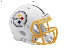 a football helmet with the pittsburgh logo on it's front and side panels,