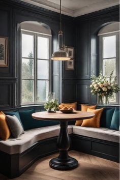 Cozy corner kitchen nook with built-in seating Kitchen Corner Tables, Kitchen Conversation Area, Moody Kitchen Nook, Black Kitchen Nook, Small Seating Area In Kitchen, Kitchen Nook Design, Booth Kitchen Table, Kitchen Eating Nook, Corner Booth Kitchen Table