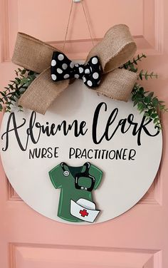 a door hanger with a nurse's name and a bow on it