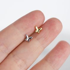 🦋 Dress your ears with these gorgeous dainty butterfly earrings! Can be worn on any part of the ear you see best fit! 🦋  🔸SOLD AS SINGLES  🔸Available in silver or gold 🔸Have you seen the full shop? We have similar styles! Check them out before you buy! 🔸Item Details: -925 Sterling Silver -18k gold plating  -3mm screw ball backings -18g (1mm thickness) -Hypoallergenic 🔺Note🔺There is a chance the gold can tarnish as it mixes with body oils because it is gold plated not gold filled or solid Dainty Butterfly Nickel-free Earrings, Dainty Nickel-free Butterfly Earrings, Dainty Butterfly Earrings For Everyday Wear, Tiny Dainty Butterfly Earrings, Minimalist Butterfly Earrings For Everyday Wear, Tiny Butterfly Dainty Earrings, Dainty Tiny Butterfly Earrings, Minimalist Butterfly Earrings For Everyday, Tiny Butterfly